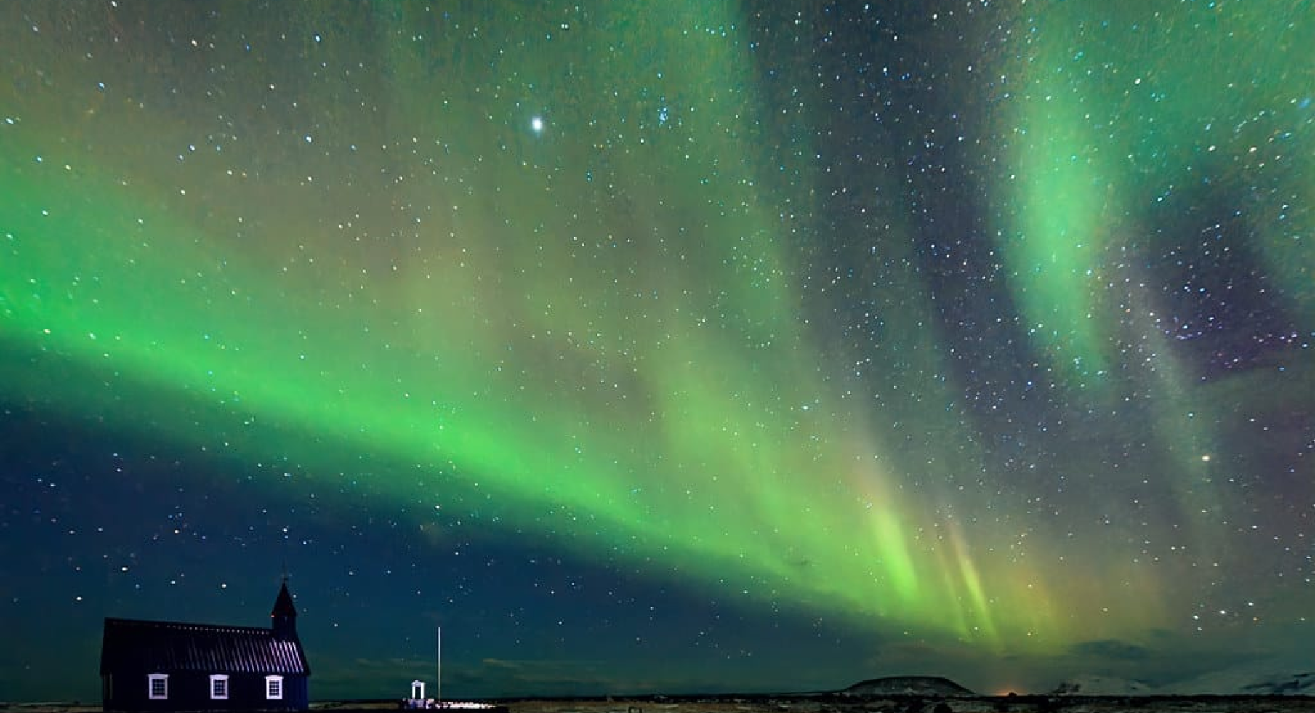 Northern lights with a hut